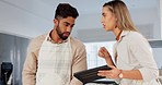 Couple, cooking and reading on tablet for online recipe, tutorial or video while helping in kitchen cutting vegetables to cook healthy food. Man and woman talking about vegan diet dinner in Europe