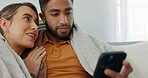 Interracial, couple, phone and love being happy together for relationship, bonding and smile in lounge at home being loving. Romantic, man and woman with online digital device, embrace or comfortable