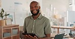 Tablet, corporate and businessman working, planning and reading an email on the internet at work. Portrait of a happy African employee with a smile while typing and networking on technology