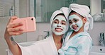 Selfie, facial and family with a mother and daughter in the bathroom of their home together. Children, love and photograph with a woman and girl kid posing for a picture while bonding in the house