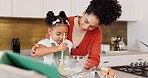 Mother, child and learning to bake in kitchen mixing ingredients of flour and eggs at home. Happy mom teaching or helping kid in baking, cooking or food bowl for mixture in fun family time together