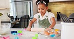 Happy girl kids baking cookies with rolling pin in kitchen, house and home for childhood fun, learning and development. Young toddler child playing little cooking chef, baker and sweets dessert dough