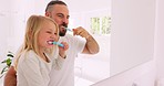 Father and kid cleaning, dental and brushing teeth in bathroom for health, hygiene and self care in family home mirror. Toothpaste, toothbrush and dad teaching young girl child fresh mouth wellness 