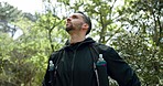 Hiking, fitness and forest man with focus, motivation and thinking of healthy lifestyle goal in nature trees. Green woods and sport, exercise person with athlete gear and training challenge idea