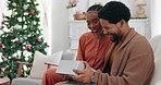 Christmas, black couple and gift to celebrate, being happy and relax for holidays in living room on sofa together. Xmas, African American man and woman share presents on vacation, loving or with kiss