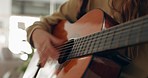 Guitar, music and hands with a woman playing a song inside as a musician, artist or performer closeup. Guitarist, live and instrument with a female entertainer strumming strings for a rhythm or tune