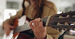 Hands, music and guitar by woman artist playing a song in a studio, live and closeup acoustic performance. Guitarist, female and hippie musician performing musical instrument for rock or metal track