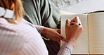 Writing, journal and zen woman hands with notebook for poetry, creative ideas or healing on her living room floor. Copywriting, journaling girl with pen and paper book for brainstorming or creativity