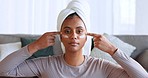 Skincare, facial cream and woman in home apply lotion, beauty products and skincare products on face. Healthy skin, wellness and portrait of Indian woman with towel, makeup and cosmetic cleanser