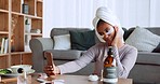 Phone, social media and beauty with a black woman influencer using antiaging under eye patch treatment in a home. Wellness, luxury and selfie with a female in her house to promote a skincare product