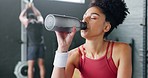 Woman, tired and drinking water in gym workout, training and exercise break for energy recovery and muscle rest. Personal trainer, fitness coach and drink for wellness, sports health and weight loss