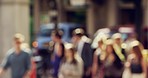 Group of people on their morning commute through a city street