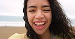 Cheerful young woman laughing while on holiday