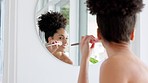 Black woman, mirror and makeup brush for morning beauty, luxury skincare and cosmetics health routine. Self care, organic make up and natural blush or skin concealer for healthy cosmetology treatment