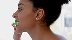 Black woman, face or brushing teeth in home bathroom, house or hotel in grooming wellness or gums bacteria healthcare. Zoom, dental care or hygiene maintenance cleaning toothbrush in handheld motion