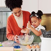 Premium Photo  Baking family and children with a mother and daughter  learning about cooking in the kitchen of their home food kids and help with  a girl and woman teaching her