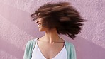 Funky woman shaking natural curly hair on pink wall background, summer sunshine and mockup. Retro, carefree and cool empowerment girl with afro hairstyle for hair care and self love mock up outdoor