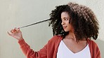 Hair, happy and smile with a black woman with an afro standing outside on a wall or gray background in summer. Hairstyle, haircare and beauty with an attractive young female laughing outdoor