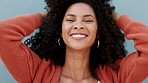 Afro woman portrait in curly natural hairstyle for empowerment, carefree and funky look on blue wall background and mockup. Cool, hair care black woman with retro hair style and a big cheerful smile