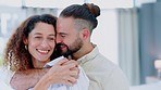 Face, happy and love with a couple hugging in their home together for care, trust or support. Smile, romance and dating with a man and woman embracing with affection while bonding in a house