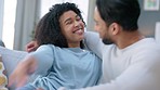 Couple, hug and smile on sofa and happy with marriage, intimacy and care in home or holiday house. Smile, love and affection latino woman with man relax on couch together in living room for summer