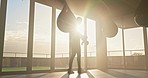 Boxer, fitness and punching bag by man at sunrise for exercise, power and training in fitness studio. Mma, fighter and workout by sports guy intense punching, energy and endurance practice at sunset
