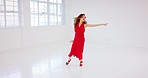 Dance, music and freedom with a latino woman training in the art of tango in a dancing studio alone. Energy, creative and performance with an attractive young female dancer in a theatre workshop