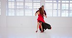 Music, dance and couple in a dance studio for tango, energy and passion, practice and fun. Partner, ballroom and woman with man in flamenco, samba and creative training, bond and dancer performance 