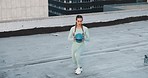 Fitness, ball and woman doing an exercise in the city on a rooftop for health, wellness and motivation. Sports, training and healthy athlete doing a lunges workout for cardio in an outdoor urban town