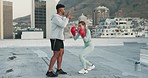 Boxing, couple and fitness training in street or city rooftop for health, wellness or strength. Boxer sports, diversity and man, woman or personal trainer outdoors practicing, exercise or workout.
