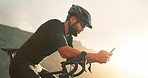 Phone, fitness and man on social media on a cycling break to recover energy on a bicycle cardio workout and exercise. Biker, sports and healthy athlete enjoys online content on a social network app