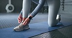 Gym woman shoes, shoelaces on floor and ready for training, exercise and body fitness. Healthy wellness girl, workout preparation sneakers on rubber flooring for cardio health and sport motivation