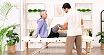 Physiotherapy, rehabilitation and injury with a mature woman and therapist in an office for diagnosis or treatment. Therapy, healthcare and recovery with a female patient and physio in session 