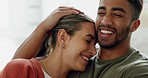 Interracial couple, bonding and laughing in house, home or hotel living room in playful, fun or love trust. Smile, happy or relax man and woman in hug, embrace or support partnership or relationship