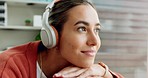 Woman, face and headphones listening to music while enjoying relaxing and thinking at home. Contemplate, think and podcast with female enjoy audio through earphones on the sofa in her house 