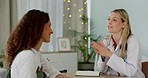 Healthcare, women and doctor consulting patient in doctors office on feminine health, fertility or body care. Medicine, advice and trust, woman with medical consultant talking at hospital appointment