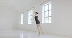 Ballerina, ballet dancer and split jumping performance, training rehearsal and choreography with split jumping technique in dance studio. Graceful, elegant and creative woman dancing skill practice 