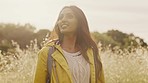 Relax, freedom and countryside with woman in field for backpacking, peace and nature. Energy, calm and environment with girl in wheat meadow for travel destination, inspiration and flowers in sunset