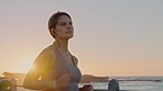 Beach, earphones and woman running at sunset for health, wellness and exercise. Sports, fitness and young female runner training while streaming radio music, audio or podcast outdoors for workout.