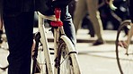 Group of people on their morning commute through a city street