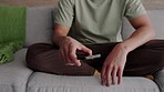 Frustrated, angry and depression while throwing phone after getting upset about slow network connection, scam or breakup text. Closeup of a man on a couch unhappy with service, losing or bad news