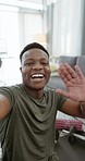 Black man, communication and video call in home for social media, online network or influencer vlog. Happy, smile or laughing young male with virtual conversation, talk and happiness relax in house