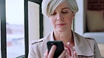 Communication, phone and business woman typing message, writing email and text on smartphone. Technology, network and mature female worker browse internet, website and online media content in office