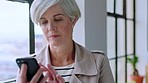 Business, woman and phone typing at office window while reading notification, news and online company investment, stock market and info. Senior mature female manager scroll on smartphone mobile app 