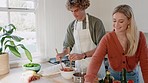 Cooking, kitchen and food with a couple preparing a meal together in their home for lunch or supper. Health, nutrition and diet with a man and woman making a healthy dinner while bonding in a house