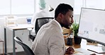 Computer, calculator and writing with a business black man at work at his desk in the office. Software, budget and digital marketing with a male employee working on a budget forecast for advertising