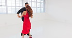 Dance, salsa and fast with a man and woman in a studio for training, dancing or performance rehearsal. Love, couple and music with a dancer and partner moving in a workshop for the creative arts