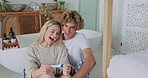 Pregnancy test, excited and positive with a couple cheering together while sitting on the bathroom floor together. Pregnant, wow and happy with a man and woman expecting a baby or child in a house
