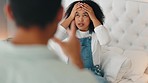 Bedroom, stress and couple fight about cheating, affair argument about relationship breakup in apartment. Mental health, divorce and toxic marriage, woman sitting on bed arguing with man in home.