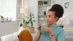 Black woman, relax and coffee by home office in morning start for freelancing business at home. African American female freelancer relaxing and enjoying a warm drink by work desk in the bedroom